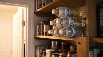 Bottled water stored on a pantry shelf