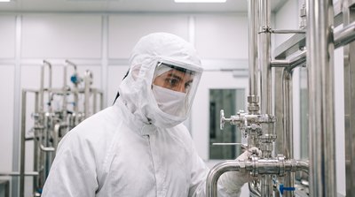 Cleanroom technician checking an ultrapure water distribution loop